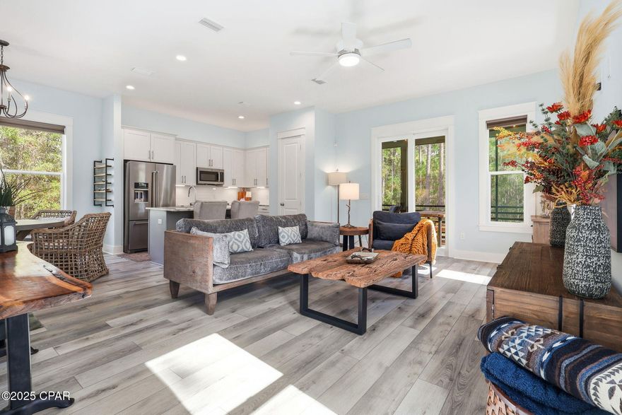 Welcome to 7537 Shady Glen Trail, located on the west end of Rivercamps on Crooked Creek: Panama City Beach's hidden wooden oasis. The development sits on 1,500 acres, two thirds of that being devoted to conservation. The community has a NEW zero-entry pool, approximately seven miles of interconnecting trails and boardwalks, boat launch and trailer storage, playground, pickle ball courts, designated campground space, NEW west-end mailboxes, and the community has officially broken ground for the future fitness center as of Nov. 2025! Rivercamps is nestled on the north side of West Bay conveniently located: 10 miles from the beach; less than 15 minutes to NW Florida Beaches International Airport (ECP); FSU/TMH Medical Campus; Watersound West Bay Center along 79 (Publix projected to open in 2026); ~45 minute boat ride to Shell Island; future Point South Marina West Bay.

Sitting on 0.62 acres, this 4 bed / 4 bath, 2492 SF home is ideal for a primary residence or second home with plenty of space to entertain. Situated on the first floor is the main living space with a half bath and kitchen, equipped with LG electric range and KitchenAid refrigerator and dishwasher. Step through the sliding glass doors onto the screened in porch with an additional fridge, perfect for entertaining morning coffee or dinner parties. The second floor hosts the primary bedroom with direct access to a screened-in balcony, spacious bathroom with plenty of storage, and walk-in closet. There are two other bedrooms on this level with opportunities to turn them into a home gym or office space nestled between the laundry area (LG WashTower Stacked Laundry Center). The third level has a second living area, full bathroom, and bedroom; within the bedroom is a hidden storage area with a door disguised as a bookcase for easy access to additional storage.