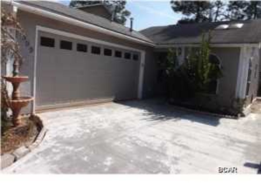 REDUCED!!! Two bedroom Two bathroom stucco home with two car garage backing up to pond in a deeded gated subdivision offered as is. The home has new carpet, paint and appliances and is ready to move in. All sizes are approximate or taken from other sources please verify accordingly.