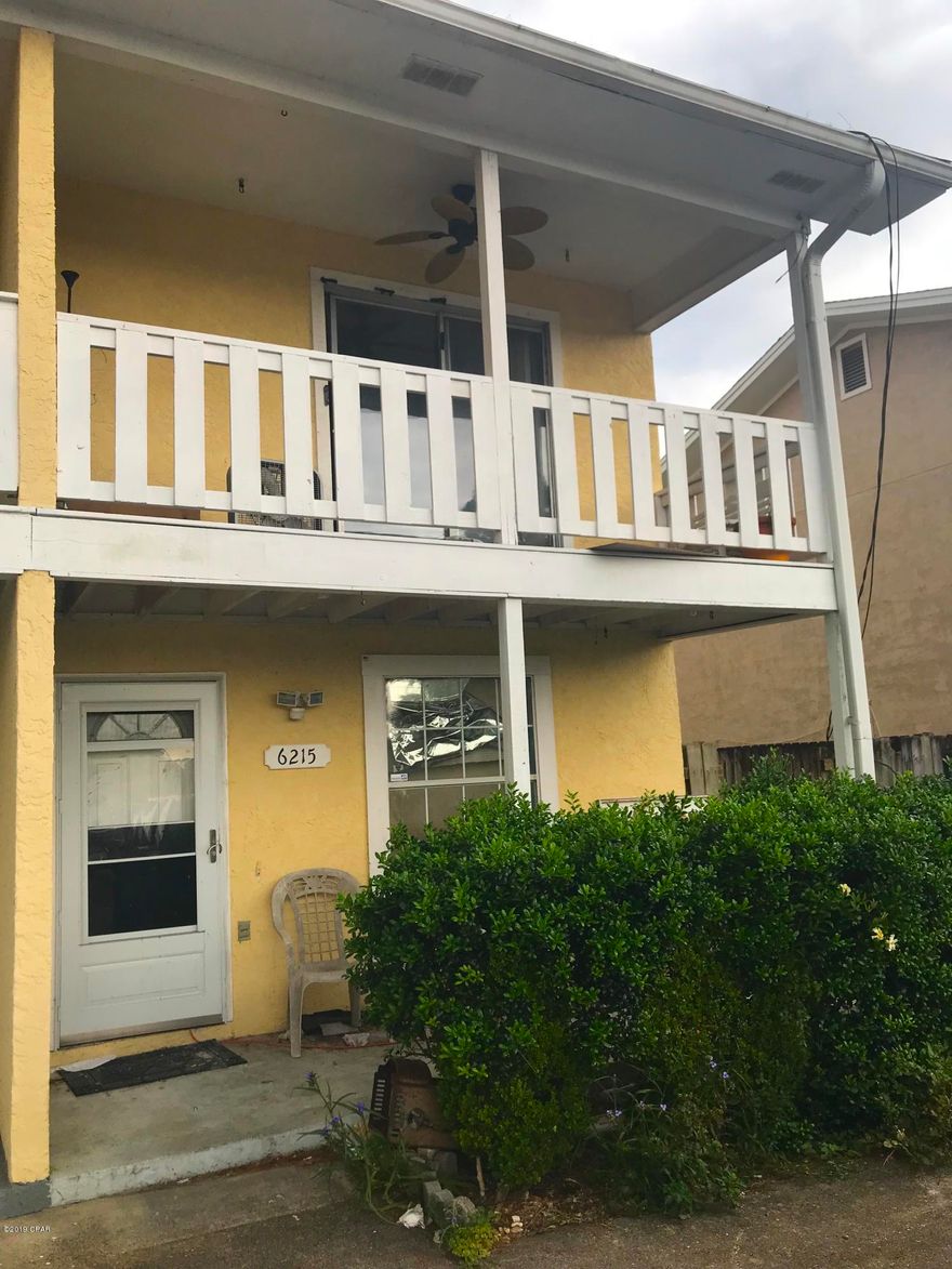 FINALLY - A great rehab fix & flip or investment property on the beach! This 2 Bedroom / 1.5 Bathroom townhouse just needs a little repair post-Hurricane Michael and it will be ready to go! It's 2 stories and all about location - It's 5 blocks off the beach, with a great public access; a few blocks from a public boat ramp; and has AMAZING water views of North Lagoon (See picture)! It's 1,080 sq. ft. (heated) and 1,394 sq. ft. (total), and has a big 2nd-story porch overlooking the water. After Hurricane Michael, the home will need some roof repair, flooring repair, etc. as you can see from the pictures. Amazing opportunity here and definitely WILL NOT LAST LONG!     ----- CASH BUYERS ONLY -----
