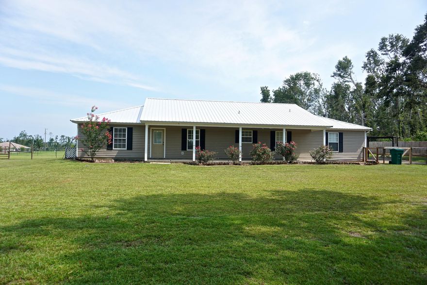 Currently Under Contract, Seller Accepting Back Up Offers! - 3 bedroom, 2 bathroom home with in-ground pool on 2 acres south of Marianna. This is an open floor plan home with spacious bonus family room, large screened porch, in-ground pool (liner replaced in 2016), pergola area, outdoor storage shed, 2 acres of fenced property, and pole barn. The property is in a great location on a paved road in front of subdivision with well-maintained homes. This is a great opportunity for you to be close to town, but have some privacy and acreage for animals and your family to grow and play!