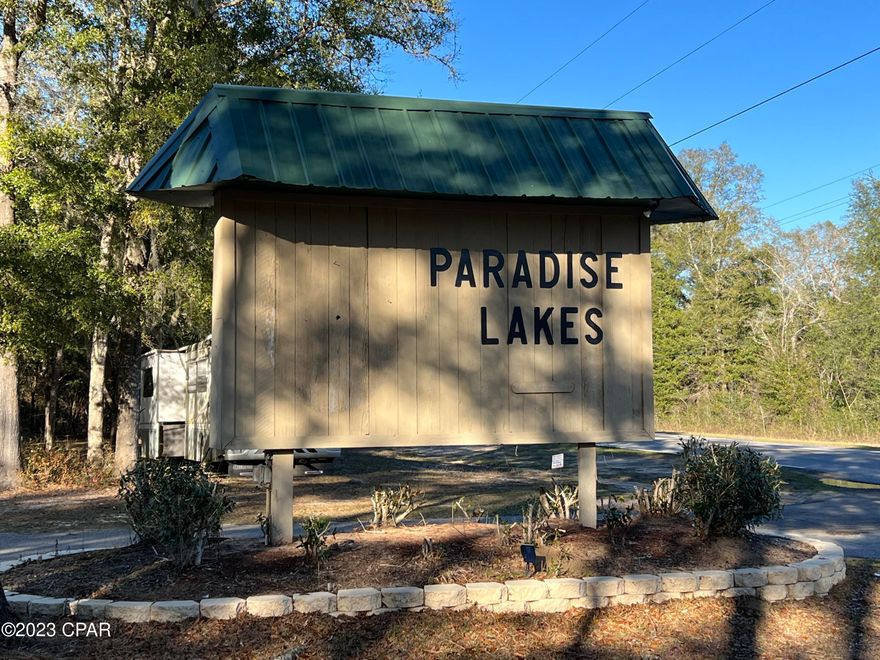 Great opportunity to build your dream home or getaway cabin on a wooded lot in Paradise Lakes. If you want to get away from the noise of the city and have a peaceful haven surrounded by nature, then this property is for you! The property is accessed by all pavement roads, which is rare in this area. There is a 0.66 acre lot right next to it also for sale, which would make both 1.23 acres combined (Parcel ID: 00000000-00-3374-0102). There is a gate to enter Paradise Lakes, you will need a code to enter. Please reach out to the listing agent to get the code.