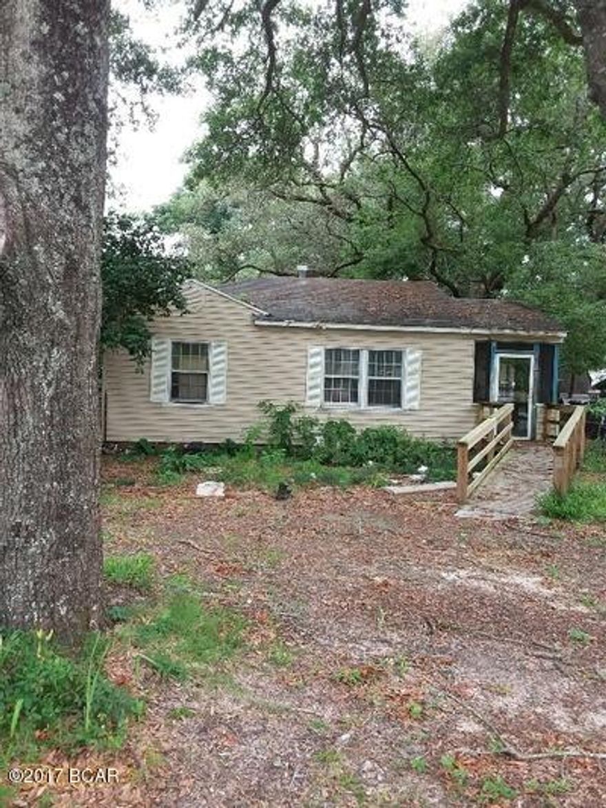 Handyman special 2/1 cottage style home situated on a lovely wooded lot in the desirable Lakewood community. The home offers hardwood flooring, a large living room, eat in kitchen & screened porch overlooking the private, fenced yard. Excellent rental investment or starter home! All Information recorded in the MLS is intended to be accurate but cannot be guaranteed, buyer advised to verify. Sold As-Is. No utilities will be turned on to this property and only cash/renovation loan offers with 0 day inspection period will be considered. Buyer should perform their due diligence/necessary inspections before submitting an offer.