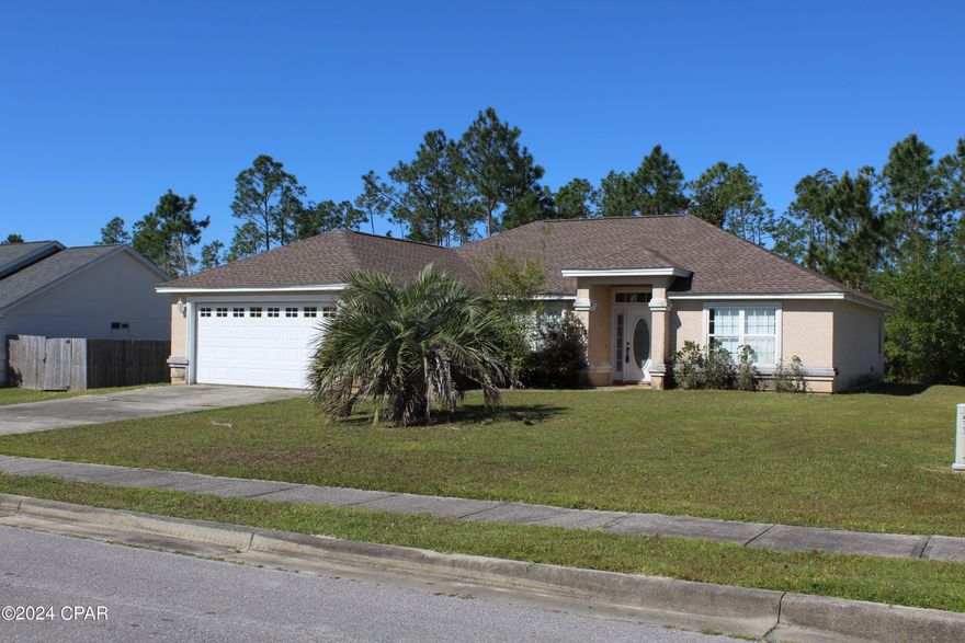 Tucked away from the hustle of the busy city you will find this 4 bedroom, 2 bath home with a split floor plan for your family with some great features.  Price improvement reflects the need for a fresh coat of paint and carpet.  She's waiting for a new family to call her ''Home''.  Schedule today to take a look!