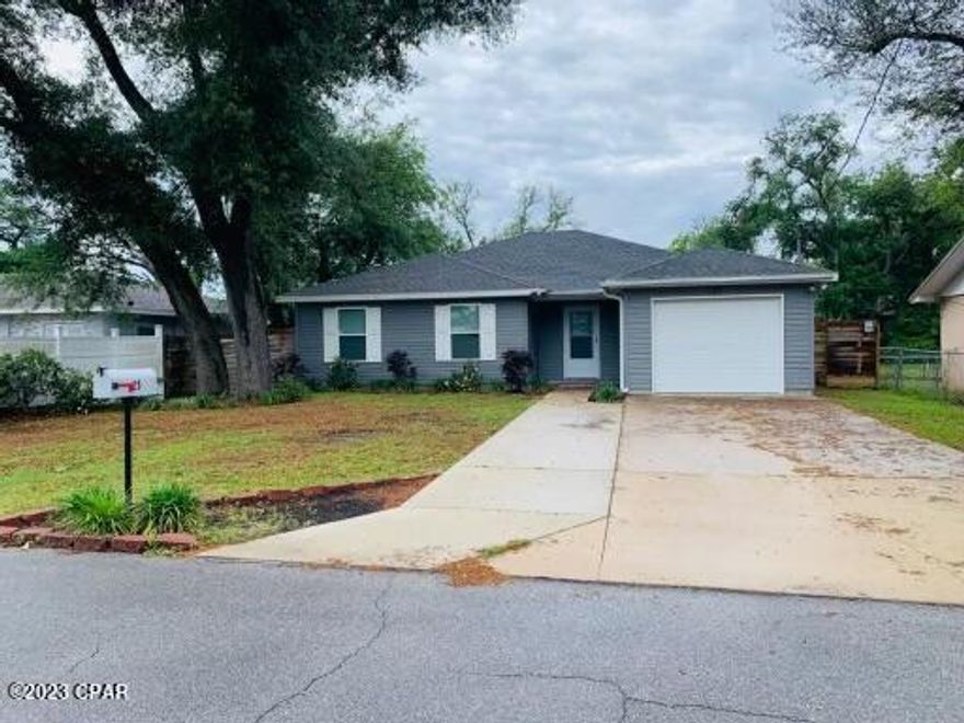 Extremely well taken care of home in the Parker are, and very close to TAFB. Just a few blocks to the Tyndall Bridge, this home is very close to Tyndall. This home features large shaded oak, one car garage, fenced in back yard with a great storage building. The interior features a split bedroom plan with lots of tile and wood floors with an enclosed Florida room, and eat in kitchen with a breakfast bar.