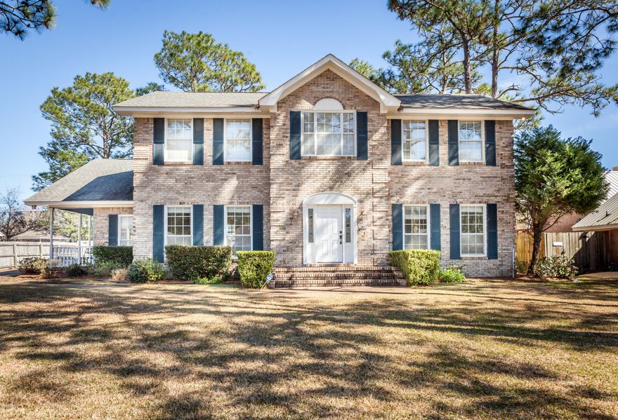 Beautiful Brick home with a large updated chef's kitchen right off the extra large family room.  Dining room is ready for the whole family for Sunday dinner.  All the baths have been redone so it feels like a brand new home. Large family room with fireplace.  Up stairs master has two closets and large garden tub in master bath. Three large extra bedrooms so everyone has their own space. The backyard is beautiful with a very  large deck and playground equipment that you feel like you are in a park.