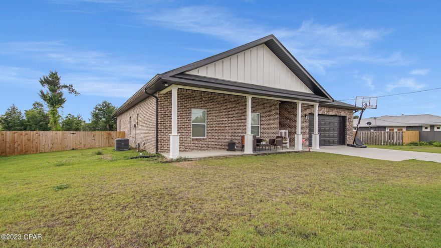 Great Location in Lynn Haven, in an established neighborhood.  Four bedroom two and half bath with spacious open floor plan complimented by high tray ceilings and LVP flooring. Modern fixtures, a stylish back splash along with beautiful granite counters really brings the kitchen to life. Soak in the tub or enjoy the tile shower that is positioned just outside the custom walk in closet. Spacious covered porch on the front is great for sitting and relaxing however the large fenced in back yard is even better for hosting family and friends.