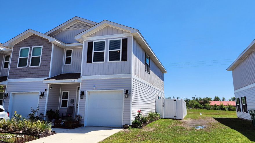 ***MOTIVATED SELLER!*** Don't miss your opportunity to own this one-of-a-kind townhome on one of the best lots at Sentinel Point! This end-unit townhome boasts an oversized, fully screened-in patio with insulated roof. Plus the bonus yard space has been wrapped with privacy white vinyl fencing, which is excellent for gardening or pets. You won't find another spot like this one! Additionally, this is a 2020 build and has a beautiful water view. The main floor features a spacious open concept, luxury vinyl plank flooring, recessed lighting, pantry, one-car garage, and a half bath. The second floor has a huge primary bedroom, walk-in closet, and en-suite bathroom with double vanity and walk-in shower. Two additional bedrooms are on the opposite side of the second floor, overlooking the pond and sharing a full bath. There's also a laundry closet and plenty of storage space! This smart home is equipped with KwikSet keyless entry, Skybell doorbell, automated porch lighting, and a Quolsys touch panel.

The Sentinel Point community offers an array of amenities, including a beautiful pool, sun deck, sidewalks, green spaces, and extra parking for guests. Enjoy maintenance-free living as the HOA includes lawn care, trash service, and exterior maintenance. Not only that, the location of this community is hard to beat! It is situated within walking distance to many shops and restaurants, including Wal-Mart, Aldi, Chick Fil A, Starbucks, and so many more. It's also just a short drive to Tyndall Air Force Base, fitness centers, and the beautiful beaches of Panama City Beach and Mexico Beach. It makes for the perfect primary residence, second home, or investment property. Schedule your showing today!