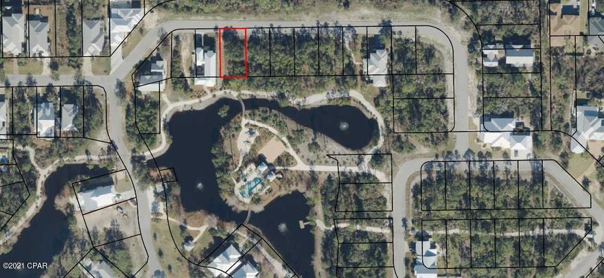 Large pond front lot in the desirable gated community of Martinique. Lot 50 is located on a quiet street in the back of Martinique.  Martinique offers custom built homes with old Florida style architecture. The neighborhood features a pool, ponds, walking trails, playground and basketball court. It is also with in walking distance of a marina and several restaurants on the east end of Panama City Beach.