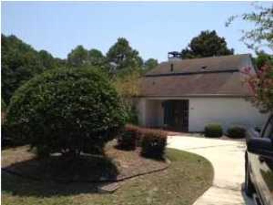 Bay Point home with three bedrooms, two bath with semi circular drive way. This home features spanish tile in living room with wood burning fire place, large screened patio, and split bedroom. Bay Point is a gated golf course and marina community.