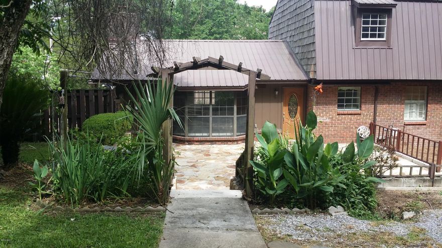 What a beautiful home! This 3 bedroom 2 and 1/2 bath home features a beautiful landscaped lawn, two story workshop with a patio just begging for a BBQ!  Large 20X40, 10ft deep in-ground pool with a gazebo.  A family room with a beautiful stone fireplace and a built-in-bookcase. This home also features a formal dining room and a formal sitting room that could be an office.  Complete with a Jenn Air Stove, security system and sprinkler system!  Close to the public library, Chipola College, doctors offices and schools, all nestled in the heart of downtown Marianna!  Make an appointment to see all this home has to offer today!