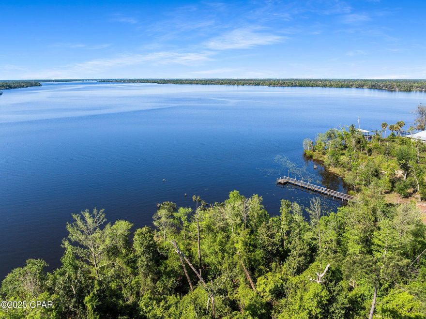 If you're looking for a Gorgeous Waterfront View in a quiet and natural environment, look no further!  This property boasts approximately 174 +/- ft of waterfront shore on Deer Point Lake!  This 1.62+/- acre property provides you the unique opportunity to Build your Dream Home with a fabulous Southern view of Deer Point Lake!  This location offers not only immediate access to fresh water activities but is approximately a 30-minute drive to the Sugar White Sand Beaches of Panama City Beach or approx. 40 minutes to Mexico Beach!  This area is in a country setting but shopping, entertainment, schools, hospitals, doctors and so much more are within a short drive.
This is a fantastic property with endless potential for you to make it your dream home site or as an investment opportunity!  
Call your favorite Realtor today and go take a look!  Thank you for considering this property and take a look at the video for this property and the parcel next door that is listed separately! All information and measurements should be verified by buyer or buyer's agent if important.