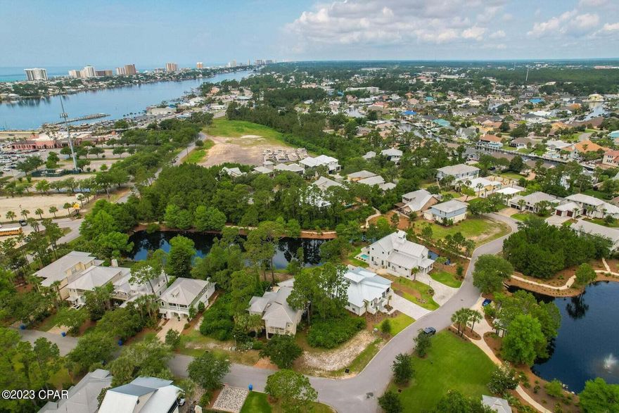 ***PRICED FOR QUCIK SALE***
Discover Martinique, one of the finest luxury home neighborhoods on the quiet end of Grand Lagoon. ''Gated'' for privacy. 
One of the best and biggest lots to build on in the neighborhood. This corner lot is a close walk to the community pool, but not too close. The common areas were well thought out, and have natural buffers around them. Walking distance to marinas and amazing restaurants. Golf cart to the Grocery store and the beach.