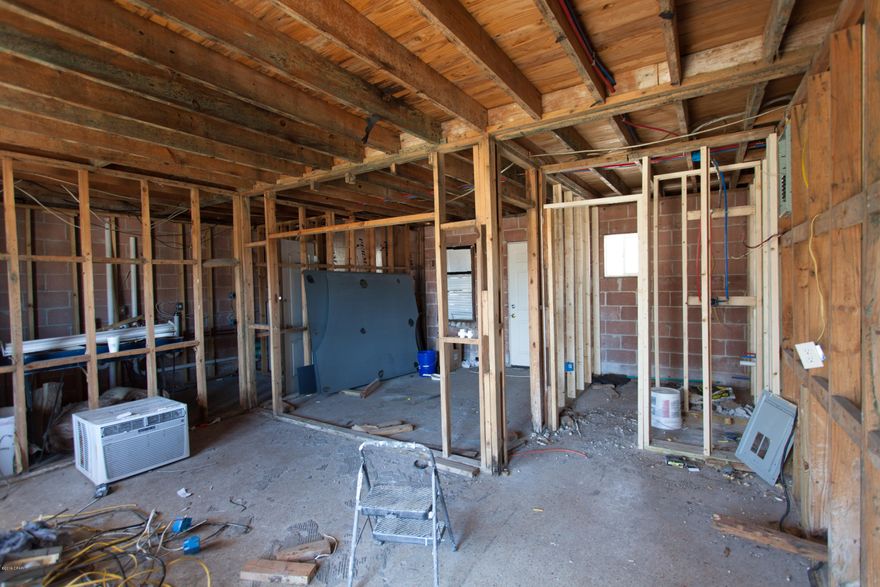 Condo wiring, sheetrock, plumbing, bathrooms, and ceiling being redone. Great opportunity get condo less than a block from the beach.  Photo of studs is current state of condo.  Other photos are of what it was prior to give idea.