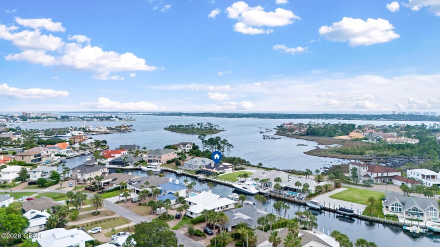 Rare opportunity in Bay Point!! Deepwater canal home with water views from BOTH the front and back of the property. One of the only homes in the community positioned this way, offering a truly unique setting you don't see often.
One of the few canal homes located east of the Bonefish Bridge, there are no boat height restrictions -ideal for serious boaters. The property features a 10,000 lb lift, ample space to accommodate a second large vessel, and a spacious dock sitting area...perfect for relaxing and watching boats come and go.
Inside, the home is designed for both comfort and entertaining with an open kitchen, dining, and living layout, enhanced by abundant windows that bring in natural light and capture water views from multiple angles. Plantation shutters line the front of the home, allowing you to fully open up or create privacy as needed.
The kitchen offers custom cabinetry, a gas range, wine cooler, and a seamless flow into the main living areas.
The primary suite is oversized and positioned to take full advantage of canal views, complete with a private sitting area. The en-suite bathroom features a soaking tub, a large walk-in shower, and separate his-and-her walk-in closets.
The second bedroom also overlooks the canal and includes a flex space with doors--perfect for an office, playroom, or additional sleeping area. A third generously sized bedroom shares a bathroom with the second.
The outdoor space is just as impressive, featuring a pool, spa, and large paver deck all enclosed for year-round enjoyment.
Additional highlights include two golf cart garages, ideal for storage, beach gear, or all the extras that come with Bay Point living! As well as a Rinnai tankless water heater.
Conveniently located near the back gate for quick access to Navy Blvd, making getting in and out of the community easy.
This is a standout waterfront property in Bay Point - offering flexibility, boating access, and views that are hard to replicate.
*Some photos have been Virtuality Staged*