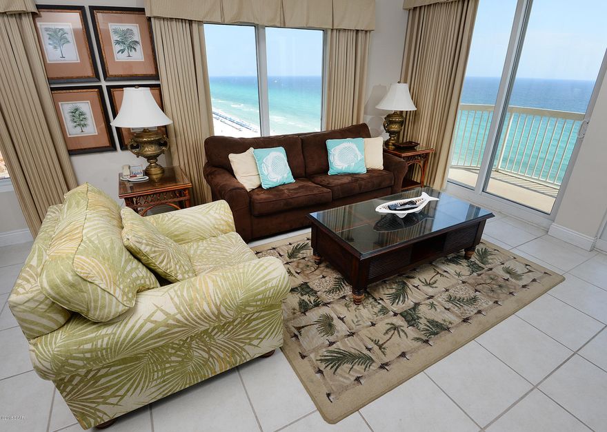 Premium 3BR End Unit at Calypso **ALL SOLID SURFACE FLOORING**  This 3BR/3BA condo at Calypso is in fantastic condition and is being offered fully furnished and rental ready.  Tile throughout the main area and bathrooms is complimented nicely by wood floors in the bedrooms.  The owners have also added a nice, glass block back splash in the kitchen.  With views from EVERY BEDROOM, these floor plans are very popular with both owners and vacationers alike.  Enjoy Calypso's fantastic pool area and Tiki Bar or take a quick stroll over to Pier Park or Miracle Strip.  There is also a parking space under the east tower available for sale.  Call for details.