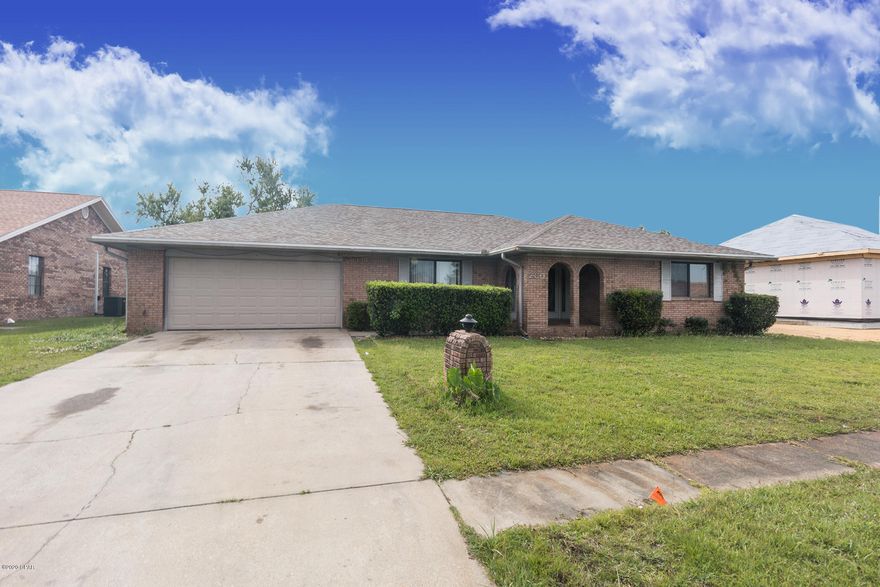 Classic, solid, traditional, all brick home in a great neighborhood. Over 2,500 sq ft to include a spacious living room, with adjoining den and separate dining room, perfect for the more formal gatherings, or large families. Brick fireplace and exposed beams on the vaulted ceilings, give a semi-rustic appearance. HUGE 21x14 private master, split bedroom plan, ideal for company, or families. FOUR bedrooms, great sized yard, double garage, growing established neighborhood. New roof in 2019!