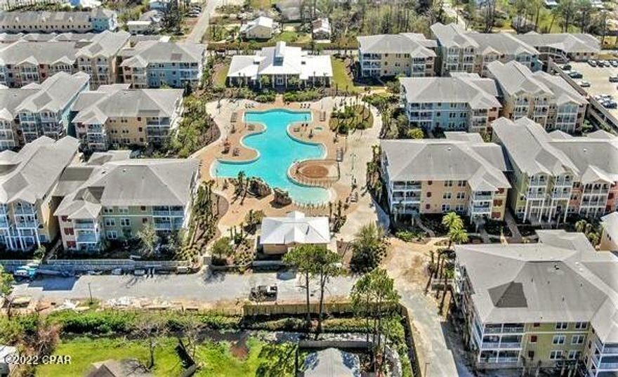 CURRENTLY UNDER CONTRACT, SELLER WILL CONSIDER BACKUP OFFERS - SELLER MOTIVATED! Highly desirable, GROUND FLOOR, Island Reserve unit now available!  This is a 1BR/1BA with a bonus room floor plan. new AC, refrigerator and washer/dryer in 2021.  This is an end unit overlooking the garden and seller says because it is north facing, the electric bill remains low!  Features include 10' ceilings, bamboo flooring, granite countertops, transom windows, French doors, and a walk-in closet attached to the bath.  This building is right next to the parking garage so you'll never get wet bringing in the groceries!  The community pool and clubhouse are just steps away.  Amenities include a movie room, basketball and volleyball court, fitness center, and more.  The Island Reserve community is located within minutes of the beach, dining and attractions.  All info is approx.  BUYERS must verify.