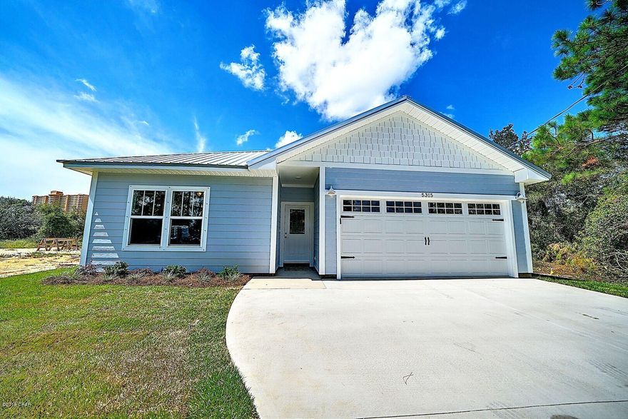 NEW CONSTRUCTION! This brand new beach home is located off Thomas Drive near many public boat ramps and beach access points. The home features hardi-like siding, metal roof, wood look plank tile, granite throughout, coastal trim package, and more. The kitchen has soft close drawers and doors, backsplash, stainless appliances and a HUGE island with storage. There is a half bath off the living/dining/kitchen area. The master bath is a dream come true with a large double vanity, jetted tub, tiled shower, separate toilet, large walk in closet and mirrored doors.