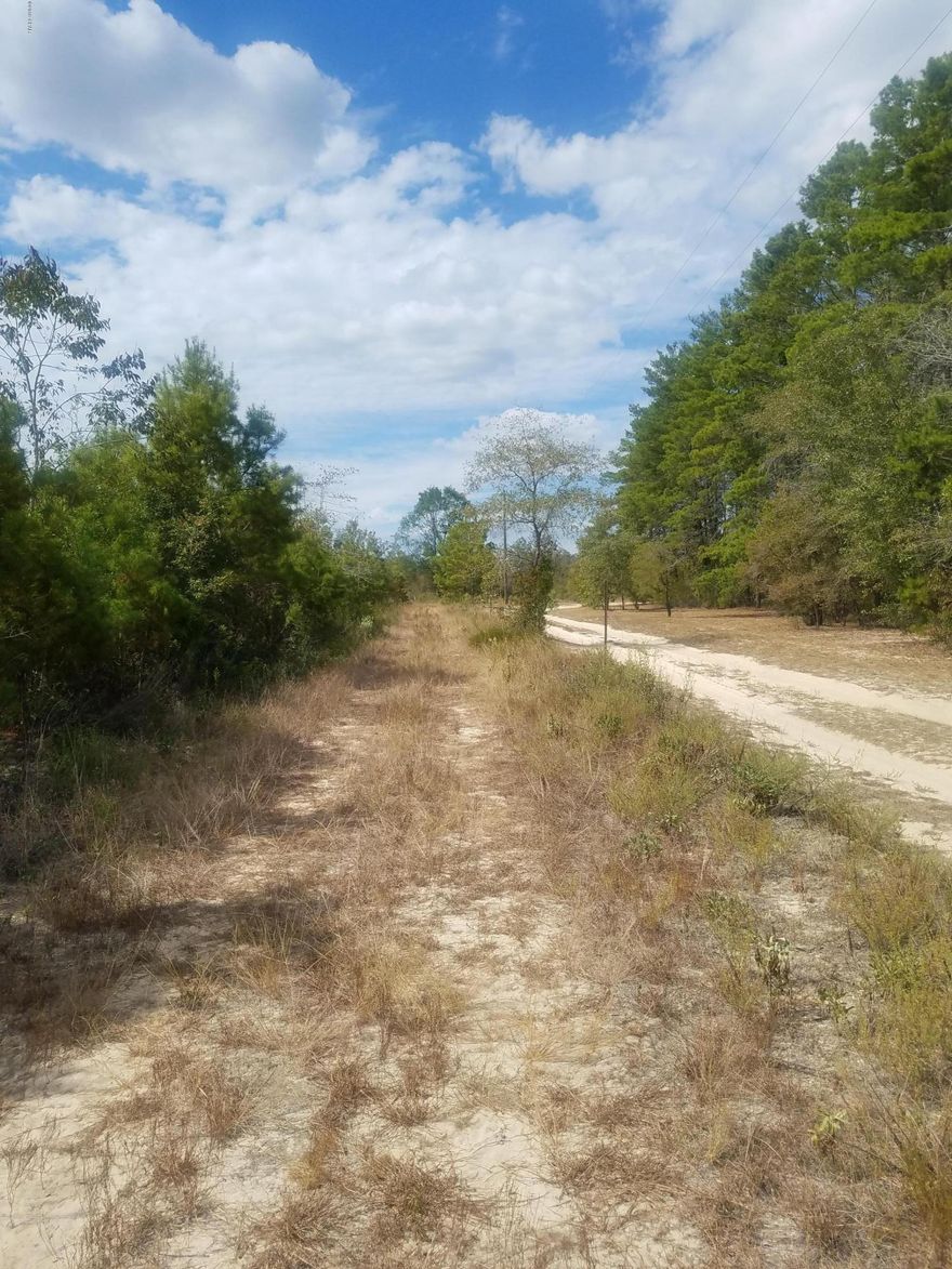 Crystal  Lake area, just off Hwy 77 North,Sought after area because of access(2 ramps) to beautiful & clear Crystal Lake(gas engines allowed) as well as the privacy & seclusion on this flat  4.78 acres. Access has been cleared to 3 sides of the property so you drive around that far. You're in the country where you can really see the stars at night but not far from town ( Panama City). If you're looking for a peaceful, quiet place in the country this is one.