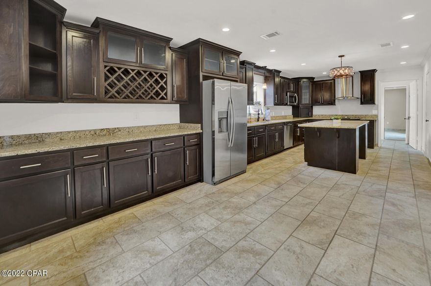 UNDER CONTRACT - ACCEPTING BACKUP OFFERS - GO SHOW! Located in Lynn Haven 3 minutes from Publix, this beautifully rennovated, 4-sided Brick, 4 Bed 3 Bath home with TWO master bedrooms with en-suite baths, sits on a CORNER DOUBLE LOT with space for all your toys! This home features a massive kitchen for entertaining with a screened in Florida room along the entire back of the home, large laundry room, carport & MORE. For the owners, they get to enjoy a quiet space along the back of the home with slider door to the screened in porch and a hotel style bathroom set up with a walk-in closet plus his & her sinks! Behind the home sits a building already equipped with electrical as well as lots of storage ready to be a great workshop or she-shed! Check it out soon!