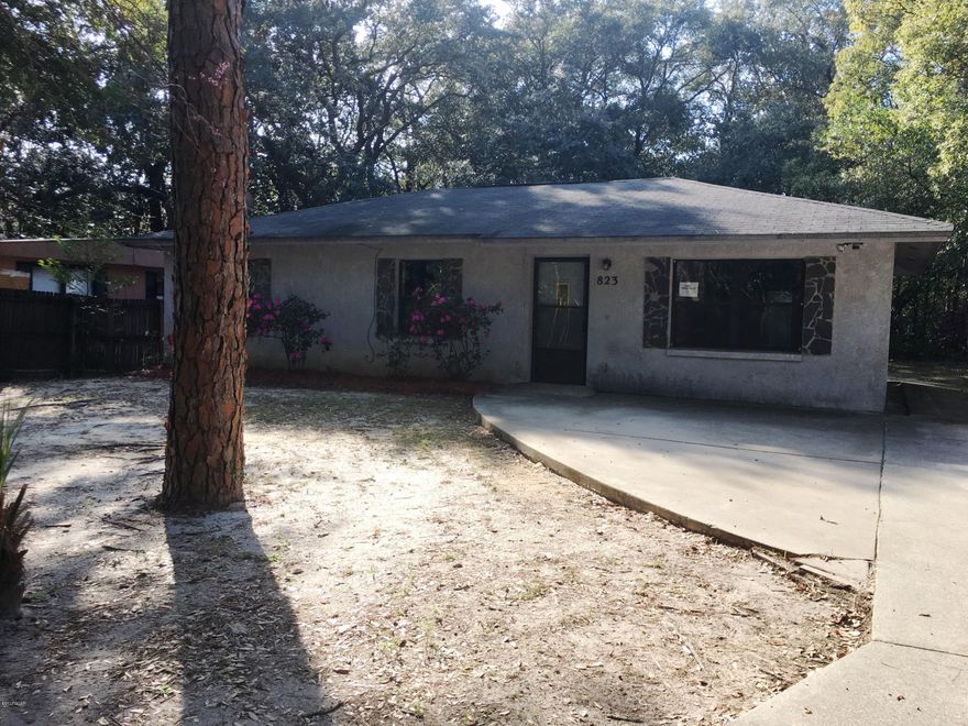 This three bedroom stucco home is located on a street with little traffic. The floor plan is ranch in style . The living room is open to the dining area. The kitchen is spacious plenty of counter space and cabinets. French doors lead out to the huge back yard off the dining area the yard is surrounded with large shade trees.