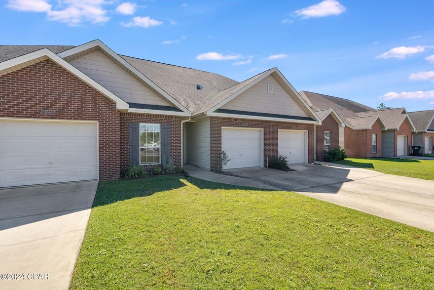 CURRENTLY UNDER CONTRACT BUT THE SELLER WILL CONSIDER BACK-UP OFFERS. This home is move-in ready and features 4 bedrooms and over 1800 square feet. The master bedroom is downstairs and there are three additional bedrooms upstairs. This home has been updated with new paint floors, roof, HVAC system, hot water heater, crown moldng, and features 9 foot high ceilings. The kitchen is beautiful bright and airy with new cabinets, corian counter tops, pantry and breakfast nook. There is also a large breakfast bar. The living and dining room are open and offer lots of natural light and overlook the backyard. The spacious downstairs master bedroom is well appointed in the hone and includes a large master bathroom with dual marble sinks, soaking tub, separate shower and extra large master closet with lots of storage. In addition to the three additional bedrooms and bathroom upstairs,  there is a very large L shaped unfinished bonus storage area with walk-in access! Don't miss the back patio, 1- car garage and laundry room. The lawn care is all taken care of through the association. One of the best features of this home is the location. You are minutes to grocery stores, restaurants, the post office  and great schools. You are only 20 minutes to Tyndall Air Force Base and 30 minutes to Panama City Beach. This home comes with an annual termite bond and YOU ARE NOT IN A FLOOD ZONE