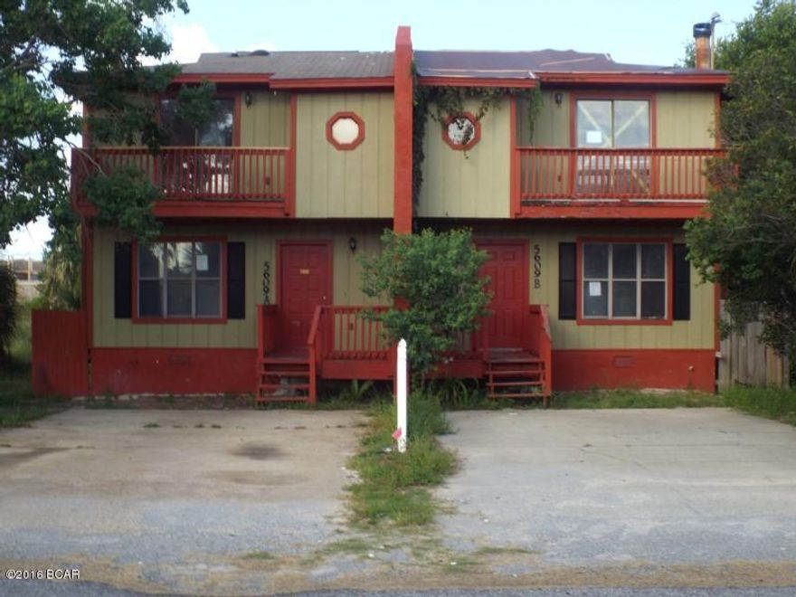 Duplex type town home (both units) for sale as is.  The two units both are on a 50x110 ft lot and has a two car parking spot for each side, a living area, kitchen, and bathroom with shower on the first Floor and two bedrooms and one  bathroom on the second floor.  Each unit has a privacy fenced back yard and needs some TLC.  Each unit has a separate parcel ID.  All sizes are approximate or taken from other sources please verify accordingly.