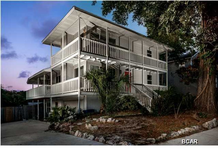 Fabulous views of the bay and lake with deep water access from this recently updated home. Only minutes to shell island and Gulf of Mexico. There's a dock and a boathouse, wrap around outside porch overlooking the bay and the lake, in ground pool with wood decking,bonus room with bath and small kitchen area(possible 4th bedroom, guest quarters or game room), great room has fireplace and incredible Bay and lake views! Recent updates include 30 Year Composition Shingles roof, new carpet in all 3 bedrooms, plumbing and carpentry repairs and a fresh coat of paint throughout the house. Age, Square Footage, and room sizes approx., if important please verify.