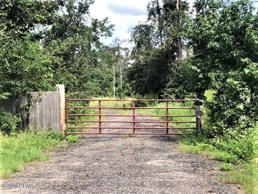 If you are looking for a nice tract of land in a quiet, peaceful setting, this is it!   There is a double wide mobile home that needs renovations completed that the owner is leaving lots of materials for you to have to finish with.  The master bedroom and bathroom need finishing, some dry wall and some flooring with vinyl plank - there is even some granite there to finish counters with.  The kitchen has all stainless appliances that include a smooth surface range, double wall ovens, dishwasher, microwave and side-by-side refrigerator.  Also included is a washer and dryer.  There is a metal storage building included.  Electricity is on.