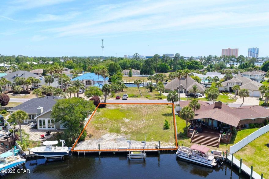Dock your boat right behind your home! One of the few remaining deep-water canal lots in Bay Point 
now available, an exceptional opportunity to build your dream waterfront home! This homesite is already equipped with water, power, and a boat lift, saving you time and significant upfront costs. Even better, the lot is perfectly positioned to look down the canal rather than across, offering long, stunning water views that truly sets it apart. House plans available, making it easy to start bringing your vision to life right away. Enjoy direct boating access from your backyard all the way to the Gulf for a day of fishing or cruising to Shell Island for a day of fun! Located in one of the area's most sought-after gated communities, Bay Point offers 24-hour security, a championship golf course, a full-service marina, on-site dining, and more. Just minutes from St. Andrews State Park, Shell Island, shopping, dining, and the beautiful white-sand beaches. This is a rare chance to own a ready-to-build waterfront lot in a premier location--don't miss it! Call today to schedule your private showing! Seller is Fl Real Estate Agent.
