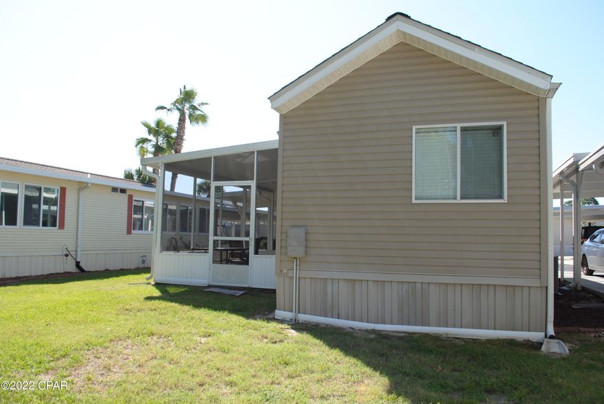 CURRENTLY UNDER CONTRACT, SELLER WILL CONSIDER BACKUP OFFERS -This is your chance to come see this cozy two bedroom, two bath unit located in Emerald Pointe Resort. The home features a bright open floorplan, tile flooring throughout, a private screened in patio, additional covered patio in front, and nice size carport for parking. Recent updates include newer dishwasher in kitchen, refrigerator, stackable washer and dryer, HVAC Unit and hot water heater. The unit is being sold fully furnished. This will make a great primary residence, vacation home or investment property. Emerald Pointe Resort is a gated community located in the heart of Panama City Beach close to restaurants, shopping, and the world's most beautiful beaches. (Cont...) It's a golf cart friendly community that offers a large clubhouse, exercise room, 2 pools (one heated seasonally), hot tub, private lake w/boardwalk and shuffleboard courts. HOA Includes: Water, Sewer, Garbage, Cable TV, and Lawn Service. All information is approximate and should be verified by buyer if important.