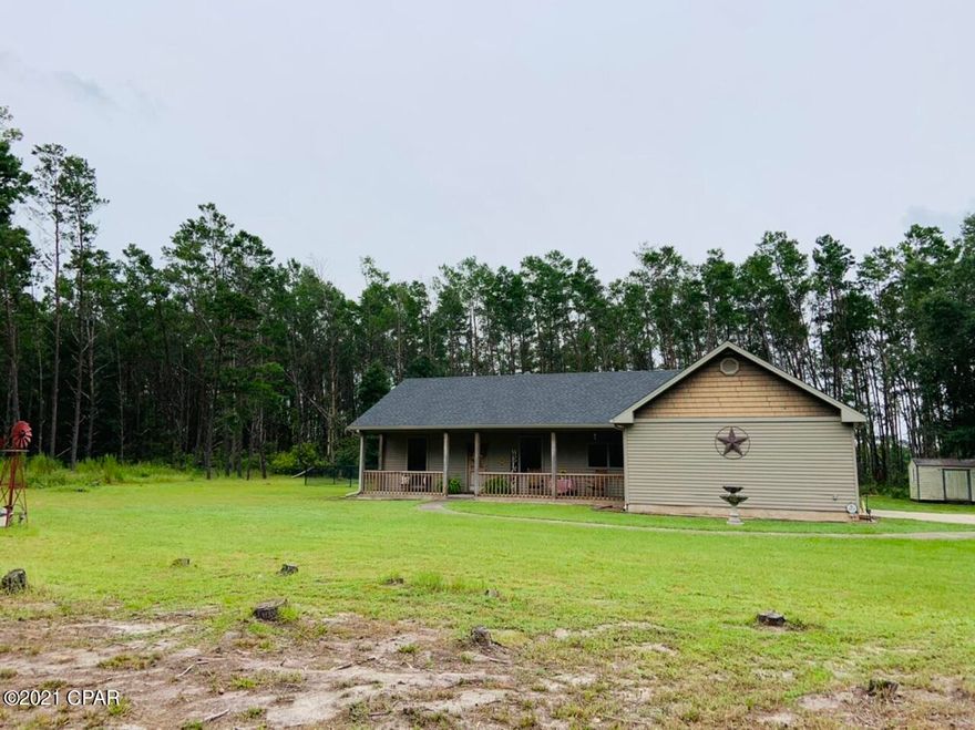 Here's a nice 3 bedroom 2 bath home sitting on 11.67 acres. Home is located on a paved highway just minutes from the wonderful Lake Talquin as well as 35 minutes from downtown Tallahassee. Home features a fenced in back yard with an above ground  pool and nice deck for relaxing. Also, there's a nice 32x60 pole barn to cover your toys. Electronic gate at the entrance of the property makes entry and exit a breeze.  Inside the home features vaulted ceilings in master bedroom as well as the living room. Wood burning fireplace in the living room to keep it cozy in the winter. Vinyl plank and tile floors, walk in tile shower in master bathroom with separate jetted tub. Home is truly a must see. Call today for your appointment.