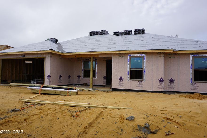 Under construction, luxury 3 bedroom 2 bath all brick home that offers large open floor plan, Master bath with his & hers double shower with Rain maker (3 shower heads) and shower seat, double vanity, large master bedroom with built-in rope lighting and large walk-in closets. The kitchen is a dream with all real hard wood cabinets, granite countertops, stainless steel appliances, cabinets in the laundry room. Living room has electric fire place, crown molding and wired for entertainment. Home comes with large front porch, back covered and open back porch, security system, thermoseal spry foam system and generator ready electrical outlet with cord. outside shower and sprinkler system. Hurricane built See pictures. Lock in price before it go up again. We use Simpson Tie down and corner tie down straps and brackets, walls bolted to foundation as well as 2+6s. DP 50 windows, hip roofing just a few we do for a strong hurricane strength house. See pictures with out dry wall. About 90 days out from completion.