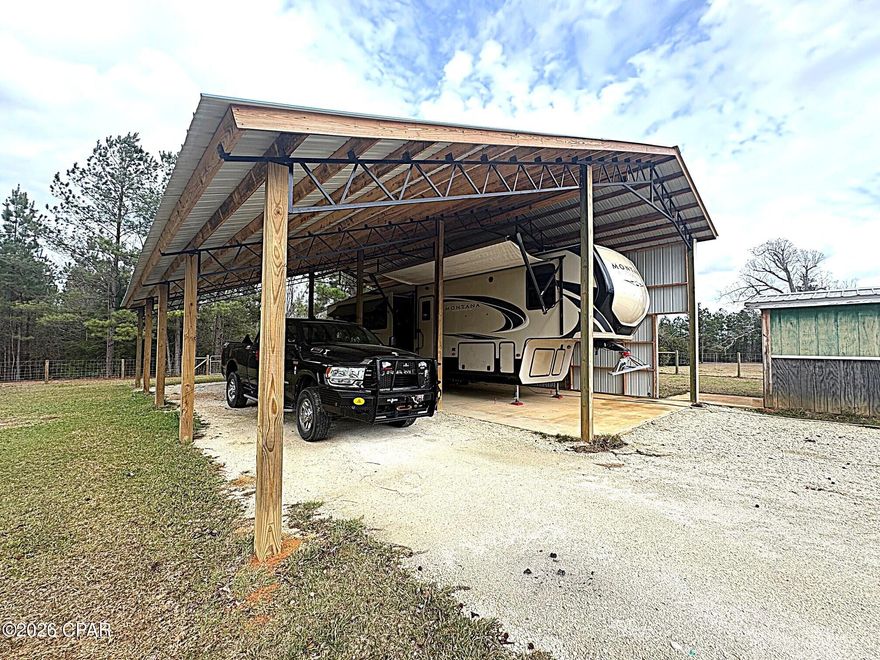 3.6 ACRES, mostly cleared but surrounded by woods, fenced, ELECTRICITY, WELL,, SEPTIC, POLEBARN WITH CONCRETE SLAB, STORAGE BUILDING. READY FOR YOUR HOME OR RV.