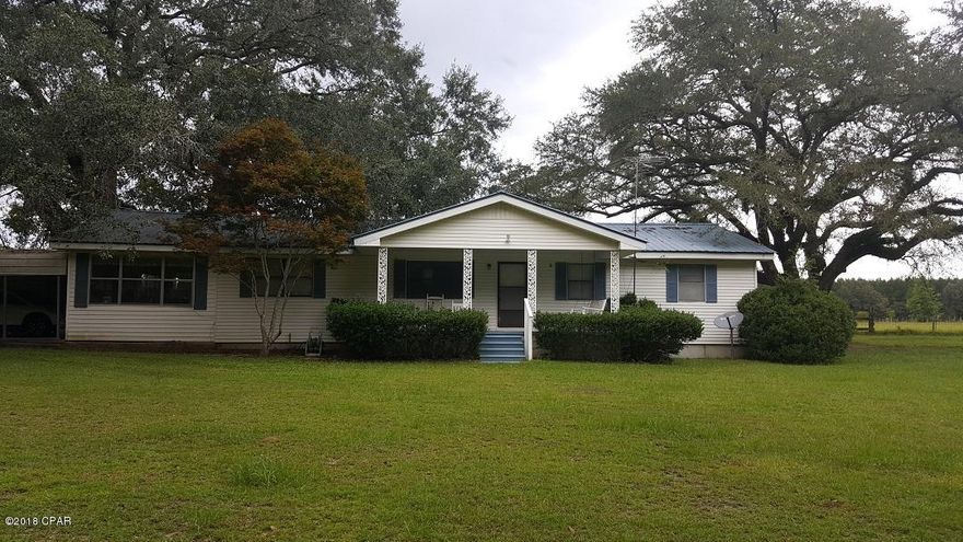 Beautiful country setting featuring the large southern oak trees. 3/2 Home is located on 3.15 acres with lots of space for gardening vegetables, year round flowers and outdoor activities. Football season is here and the large sunroom will be perfect for entertaining spills, no problem, it has indoor/outdoor carpet. Extra outside storage. Country living with convenience, a must see...Call Listing Agent for Appointment.