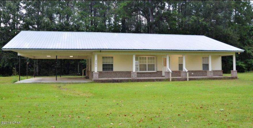 If you are looking for a home in the country, don't miss this one.  This home has many extras to include a metal roof, tile flooring, a gas stove, a new Culligan water filtration system, a jacuzzi in the master bathroom, an office, separate power pole for the outbuildings which include a barn and a cook-house.  Bonus: There is also a chicken coop to house your chickens.