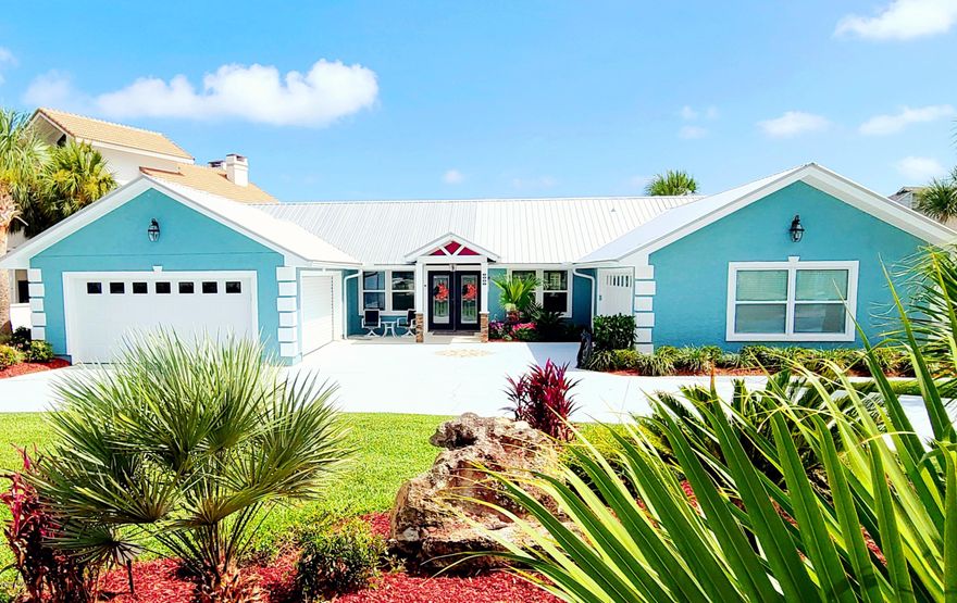 UNDER CONTRACT, SELLER ACCEPTING BACK UP OFFERS  TALK ABOUT ''BELLS AND WHISTLES''! This home has them all! Decorated and designed to perfection. This is a true custom home. There are to many upgrades to list. A full chefs kitchen with all high end appliances, including a stove pot filler, smart refrigerator, gas stove, and a refrigerated beer tap and wine cooler. This property is also beautifully landscaped with a sharp eye for detail. The property boast a beautiful in-ground swimming pool with color changing lights overlooking the canal with a boat lift and dock. This home has outdoor entertainment written all over it, down to the fully stocked screened-in outdoor kitchen and veranda overlooking the pool. The home has two separate garages, one of which is 500 sq. ft. temp. controlled.