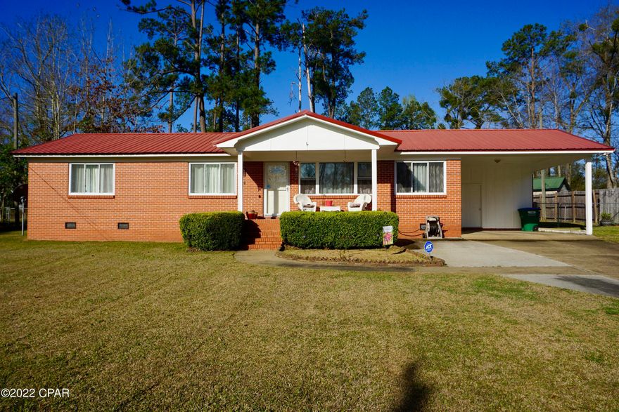 Beautiful, well-kept home with lots of updates and gorgeous owners' suite! Located in a quiet neighborhood of Chattahoochee, this brick home has been in the same family since it was built and the love and care for it is evident at every turn. The covered front porch opens into a spacious living room with bright picture windows. The kitchen is open to a beautiful dining space which looks out on the fenced-in backyard.  Kitchen appliances are newer stainless steel. There are three large bedrooms and two baths.  The owners' suite has been completely revamped to include a stunning bathroom with a double tiled shower. There is a covered carport with separate entry and storage/laundry room (washer/dryer are staying). This home has great outdoor spaces with a large deck that runs nearly the length of the home in the backyard. The neighborhood features its own park which has been recently updated with playground equipment, basketball courts, and a large pavilion for picnics. Home is located just minutes from historic downtown Chattahoochee, the Apalachicola River and Lake Seminole.  A quick 45 minutes drive to Tallahassee and within two hours of some of Florida's most beautiful beaches.