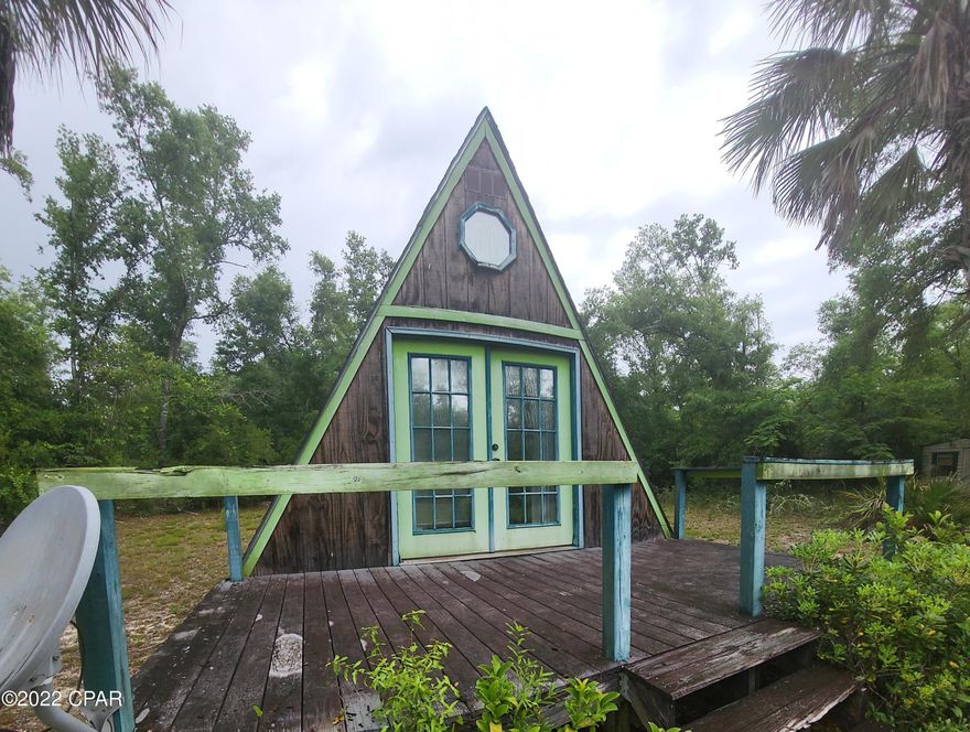 This A-frame cabin sits on slightly over half an acre and is the perfect spot to get away from the hustle and bustle of life in the city! Stoke the fire pit, camp, park your toys and enjoy nearby boat launches (photos of maps to illustrate how close they are will be attached), OR move to a life in a tiny home, with all the conveniences such as a full kitchen, bathroom with a shower, a nice sized storage shed, large loft space for some private sleep quarters, and the furniture conveys...sleep 2 upstairs, 4 downstairs. Check out the antique details sellers have used to embellish the overall look and feel of this sweet escape! Call for a private tour today! Priced to sell, this will be a cash only sale.



(measurements, info are approx and should be verified)