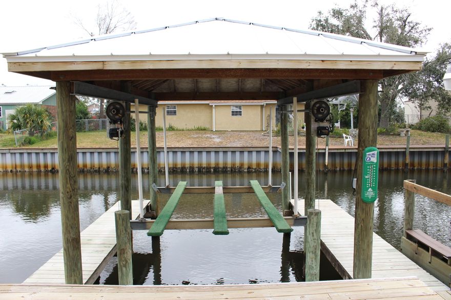 ***COMING SOON - FIRST WEEK OF APRIL***Water front with undercover boat lift for flat boat/jet skis or pontoon with canal access to Bay! Impressive town home in Venetian Villas, large open planned living, custom cabinets with granite counter tops, stainless steel appliances and breakfast bar. Large full deck of living area, up stairs you'll find the master suite with built in closets, huge master bathroom with double vanity and walk in shower with bath enclosure. The two other bedrooms have built in closets and the 2nd full bathroom has tub/shower combo and separate water closet. Laundry room with washer and dryer for convenience. Single car garage. APPLICATION IS REQUIRED PRIOR TO SHOWING