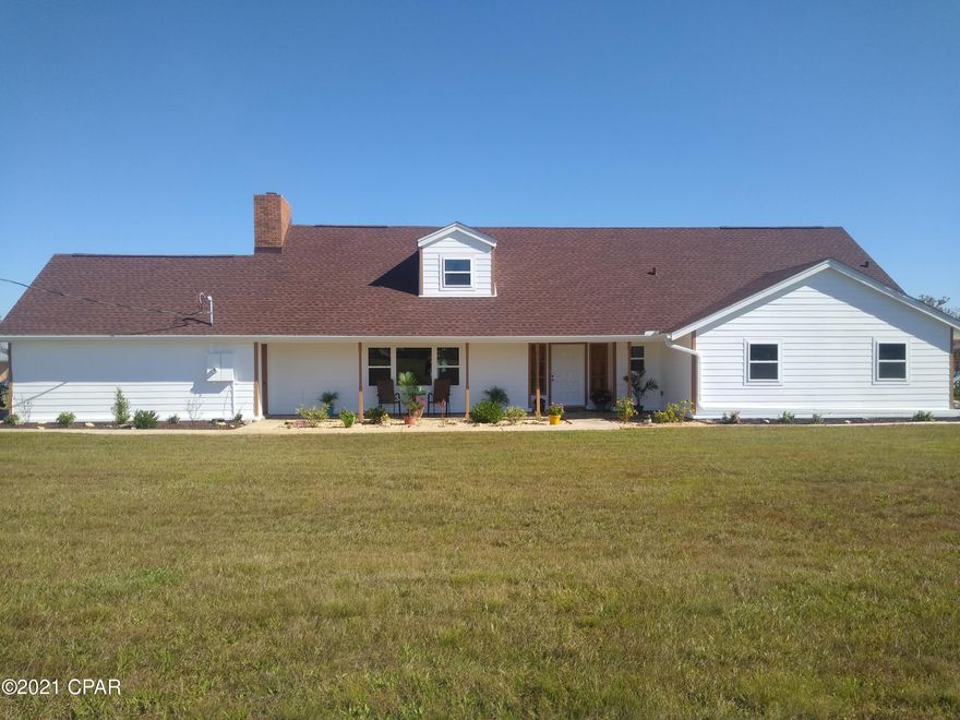 CURRENTLY UNDER CONTRACT, SELLER ACCEPTING BACKUP OFFERS - Beautiful Deer Point lake home with 4 bedrooms, bonus room and 2 baths.  2.61 acres. Amazing views and great fishing. Boat Ramp to both Deer Point Lake and the Bay 1 mile away.  Two story home with first floor master bedroom, second bedroom + bonus room, main bathroom, lovely spiral staircase, family room with grand fireplace, large open kitchen with pantry and formal dining room. Second floor features two large bedrooms and a bathroom.  Large front porch and screened back porch with built in brick smoker. Laundry room on first floor.  2 car garage. New Roof 2020, exterior of home completely redone with hardie board and fresh paint. New hurricane impact windows, electric panels, water heater, tile flooring,