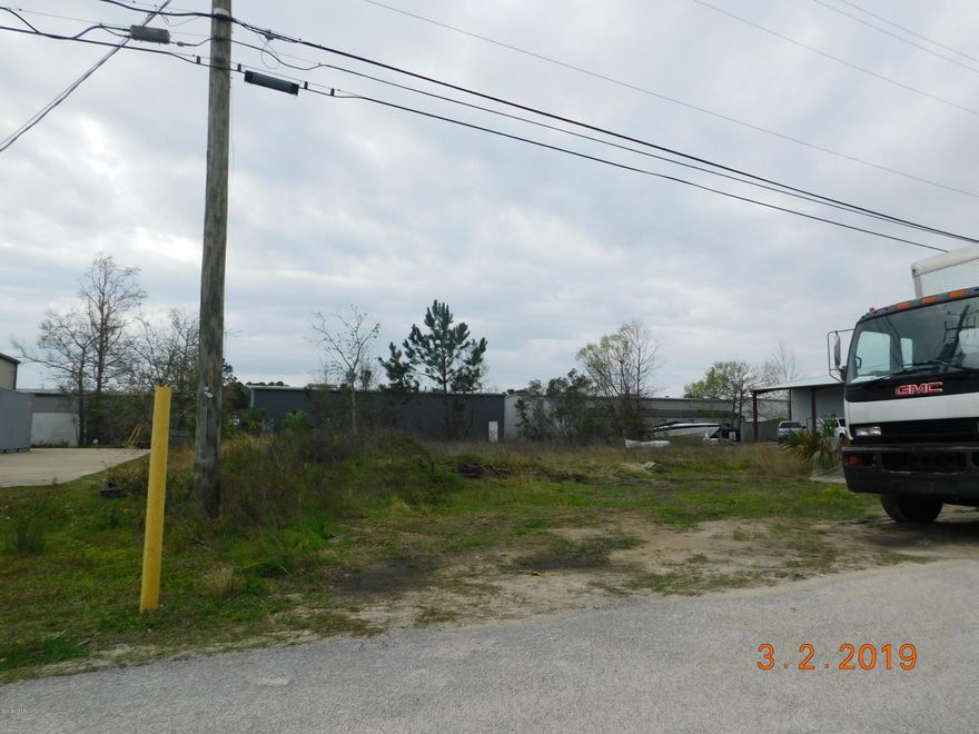 Commercial Lot located in the Commercial Park just off Thomas Dr. Great for warehouse, fenced storage area or office suites.