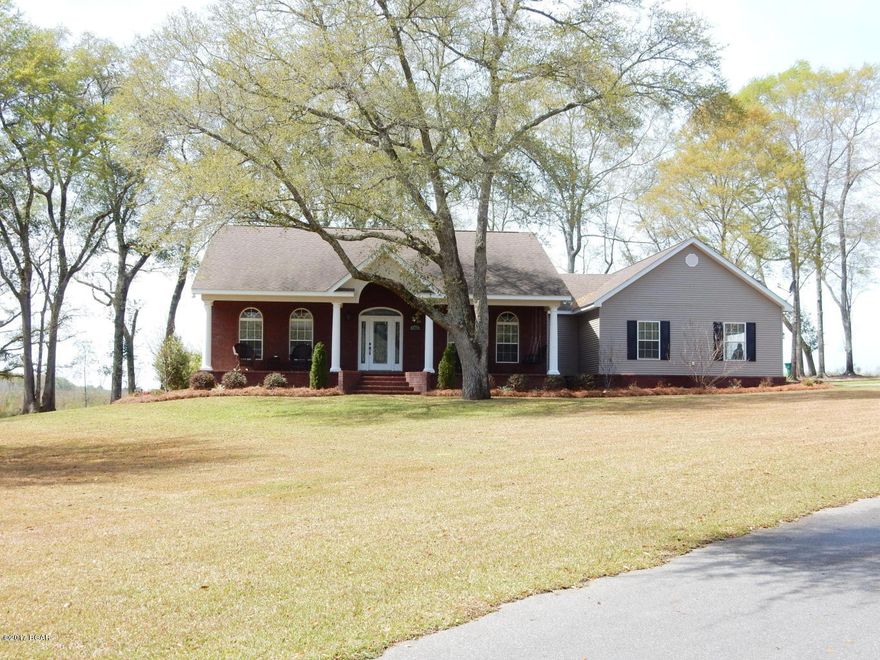 BEAUTIFUL  CUSTOM BUILT HOME NESTLED ON MORE THAN 3.4 ACRES IN PINEY GROVE ESTATES. THIS 4/2.5 BRICK BEAUTY FEATURES AN OPEN CONCEPT WITH SPLIT FLOOR PLAN, FRESH PAINT, NEW HVAC, FORMAL DINING ROOM, ABUNDANCE OF STORAGE, CROWN MOULDING THROUGHOUT, SPACIOUS LIVINGROOM WITH CATHERDRAL CEILING AND WOOD BURNING FIREPLACE. KITCHEN BOAST STAINLESS STEEL APPLIANCES (NEW REFRIGERATOR), BREAKFAST BAR, GRANITE COUNTERTOPS AND LARGE PANTRY. MASTERSUITE INCLUDES, WALK-IN TILE SHOWER, DOUBLE VANITY AND MASSIVE WALK-IN CLOSET. OUTSIDE FEATURES INCLUDE NEW WORKSHOP, FENCED BACK YARD, IRRIGATION, LANDSCAPING, NEW WELL AND AN ASPHAULT DRIVE. THIS IS A MUST SEE.