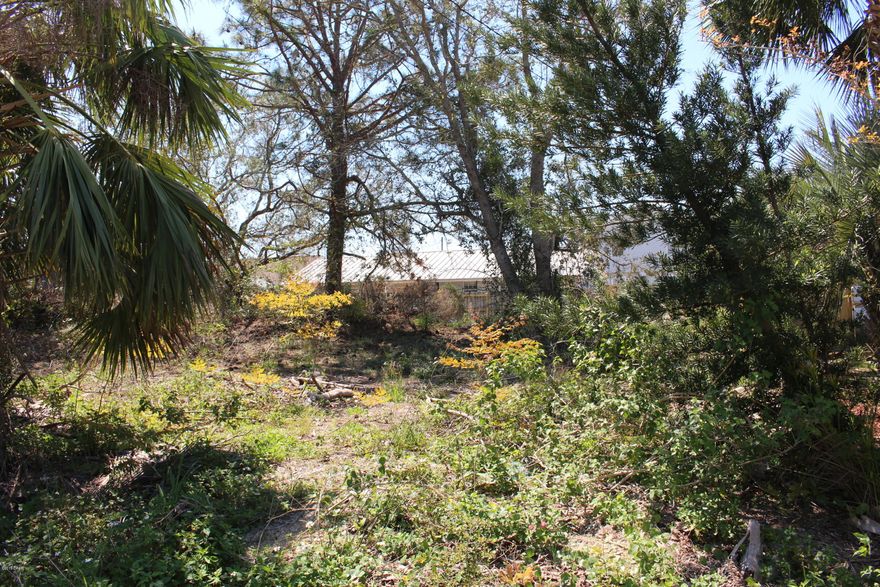 Rare building lot located in South Lagoon area of the Beach.  Property is located within 4 blocks of the public beach access and close to public boat ramps.  Lot is irregularly shaped with approximately 133 feet along Pinetree Avenue and contains .17 acres.  Own a piece of the beach.  Current zoning suggests R-3, which allows for detached single family or duplex.