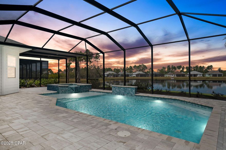 Highly upgraded, pond-front home with luxury pool & spa! 

This spectacular TRINIDAD BAY, Island Collection home offers an unmatched blend of luxury, comfort, and the Latitude lifestyle. Perfectly positioned on an expansive pond lot, this residence showcases a saltwater, heated pool with spa and waterfall feature, surrounded by pavers and fully screened for year-round enjoyment. 

Interior Features include; Level 5 Colada kitchen cabinetry with Sub-Zero refrigerator, KitchenAid double oven/microwave, and Wolf gas cooktop
Level 5 Quartz countertops, range hood, oversized island, and spacious walk-in pantry. Large, open dining and living areas plus a separate family room with fireplace. Den/office with built-in cabinetry, wet bar with wine cooler, and glass French doors. 

Custom window treatments, designer paint, upgraded crown moldings, and 8 ft doors throughout. 3 bedrooms and 3 full baths, with all guest baths upgraded with tile showers. Primary suite overlooking the pool and pond, spa-like bath with zero-entry frameless shower enclosure and rain shower upgrade. 

Designer tile flooring throughout the home. Hurricane Impact windows/doors in entire home/garage. Huge laundry room with built-in cabinetry, laundry sink, and newer washer/dryer. Spacious 3-car garage with upgraded floor coating, insulation package, and smart garage door openers with camera function. Whole-house WiFi, Sonos and theater package, built-in speakers on the lanai and in the den/office areas. Gorgeous paver driveway and walkway. 

Every detail of this home was carefully designed and upgraded for both beauty and functionality. From the luxury kitchen and spa-inspired primary suite to the resort-style outdoor living, this is a home where no detail was spared. 

Living in Latitude Margaritaville Watersound means embracing a true resort-style, active adult 55+ community, coastal lifestyle designed for fun and relaxation. At the heart of it all is the Town Square where live entertainment fills the air on a daily basis and every Fri/Sat. night! Homeowners enjoy: The Resort-style pools- perfect for lounging in the Florida sunshine or enjoying a swim with friends. State-of-the-art fitness center & group classes - including yoga, spin classes and lap pool and spa, water aerobics to name a few. Walking, biking, and golf cart trails that wind through the community with easy access to all amenities and a underpasses for safe and convenient access throughout the neighborhood. Sports courts - including pickleball, tennis, and bocce, basketball encouraging friendly competition and active living. Kayak launch for adventure seekers, Last Mango Theater for shows and events, ceramics and wood working shops, pet grooming and a dedicated dog park. 

Beyond the amenities, Latitude Margaritaville Watersound offers a low-maintenance lifestyle—with lawn care included in HOA dues, the home has a 10 structural warranty from the original owners close date.

Whether it's a sunset golf cart ride, cocktails by the pool, or mingling with neighbors at one of the many social events, this is a place where every day feels like a vacation. This home is more than just a showcase of luxury and upgrades—it's your gateway to the Latitude Margaritaville lifestyle. This home offers comfort, elegance, and the vibrant energy of Latitude Margaritaville Watersound, the essence of coastal living at its finest.