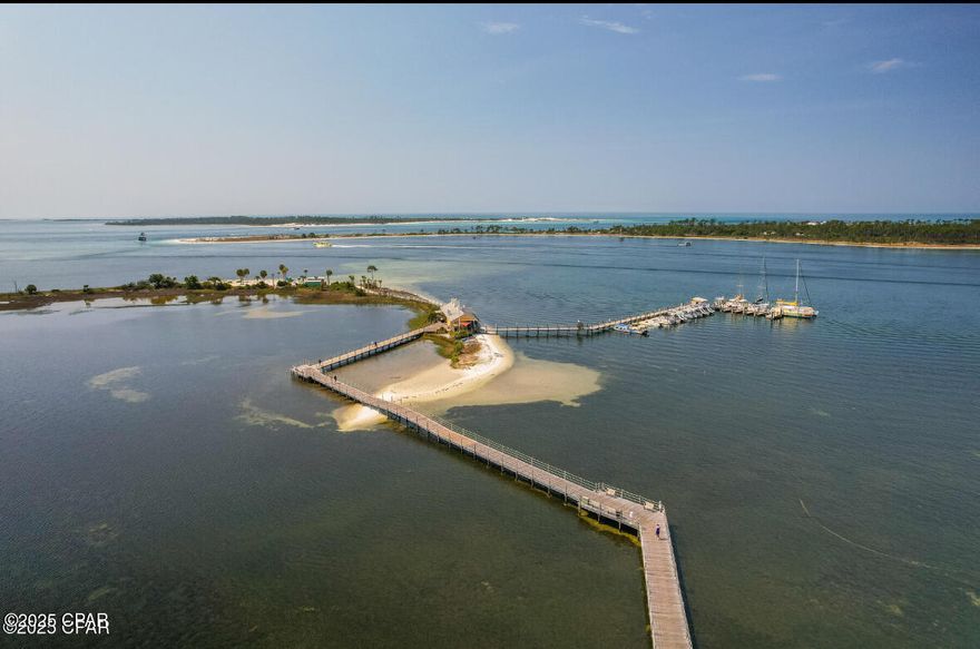 Step into this stunning condo, perfectly situated on the golf course with waterfront views. This meticulously maintained residence features an updated kitchen with top-of-the-line appliances and intricate design details throughout. The wood ceilings add warmth and character, creating a cozy yet elegant atmosphere. Enjoy the ambiance of a brand-new electric fireplace, perfect for relaxing evenings. The fully remodeled bathroom boasts a luxurious walk-in shower, offering a spa-like experience in the comfort of your own home.

Directly across from the marina, you'll be in the heart of the action where the annual Billfish Tournament takes place, making this a prime location for boating and fishing enthusiasts.

Bay Point offers an array of amenities, including a community room, a boat launch, fishing, a golf course, tennis courts, beach access, and restaurants and bars throughout the community. Whether you're an avid golfer or simply looking for a serene retreat, this condo is a rare find that perfectly blends style, comfort, and convenience. Don't miss the opportunity to make this exceptional property your own!

This unit can be used as a short term rental, and currently sleeps 4. There is potential to add more beds by adding bunkbeds.