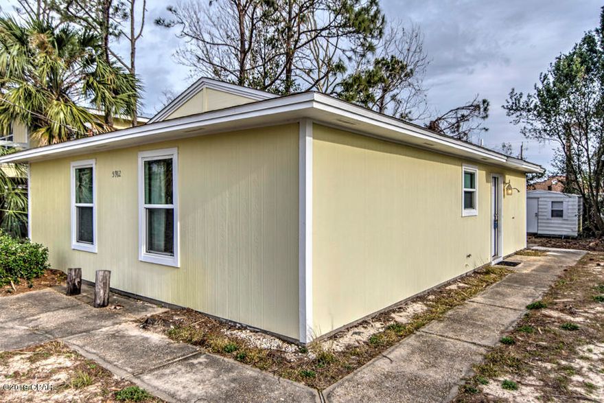 Charming Florida Beach Cottage, perfect for full time living, as a second home or as an investment property! The 2 bedroom / 2 bath home is immaculate and move-in ready, fully furnished and no grass to cut. The lot is big enough to store your own boat and 2 blocks to a public boat ramp with deep water access to the Gulf of Mexico and 5 blocks to the sandy beach. Located close to shopping, entertainment, restaurants and a short drive to St. Andrews park and Pier Park. Newer A/C system, fresh paint and roof in great condition. One owner since 1984, not a rental. City water and private septic. Includes an aluminum storage shed valued at $4,000.