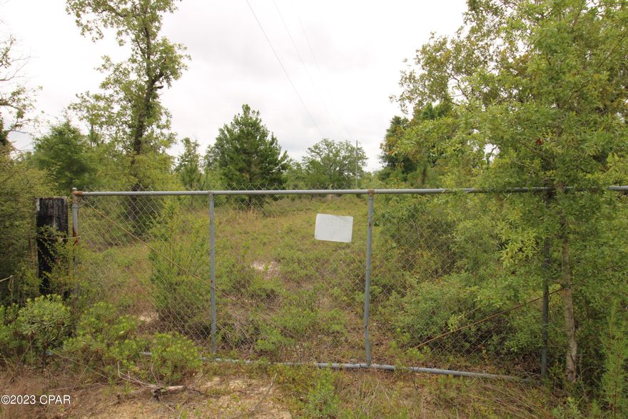 'CURRENTLY UNDER CONTRACT, SELLER ACCEPTING BACKUP OFFERS' 
Here you have 4.3 acres just a 30-mile drive to the heart of Panama City and another 10 miles and you're sitting on the beach. This is a great high and dry property with plenty of land to spread out on.  Clarks Road turns off of a paved road, so it is just a few hundred yards of a maintained dirt road to drive. There is mobile home on site that is of no value and the condition is unknown. This would indicate that a well and septic are available, but the condition is unknown and will have to be investigated.