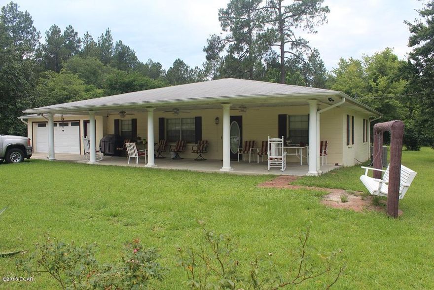 Well cared for block construction home on large lot.  This home has the perfect front porch for sitt'in.  The home is clean and offers an open living room dinning room floor plan.  The kitchen has been upgraded with lots of granite counter tops and oak cabinets.  The third bedroom was converted into a den, but could easily be converted back to a third bedroom by adding the closet back.  The extra large garage as a/c duct work in place in case you would like to convert the two car garage into a large bonus room, play room, studio, office, or work out room.  This home is just on the outskirts of town and its big enough for horses.