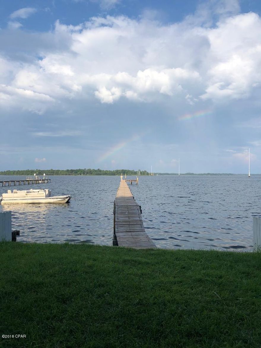 AFFORDABLE WATERFRONT LIVING.. IN STYLE!  Furnished large 2,300sqft 3bd, 2.5ba townhouse on the Bay! Immaculate condition, completely remodeled/upgraded kitchen, stainless appliances, breakfast bar, open floor plan with wood-burning fireplace, exposed beams, unique Craftsman-style surprise. Huge covered balcony off living room. Luxury vinyl planking, hardwood, and tile floors throughout = no carpet. Large master bedroom with extra sitting area- check out the view. Large walk-in closet.

Game room on bottom floor with pool table. Also downstairs is a huge, finished bonus storage room or office. See pics. W/D hookup. 2-car detached garage. Backyard lawn and your own private dock with everything you need to keep your boat at home. Pets negotiable, restrictions apply.  Pls get pet approval before scheduling showing appointment. Furnished, but can also be leased unfurnished if desired.